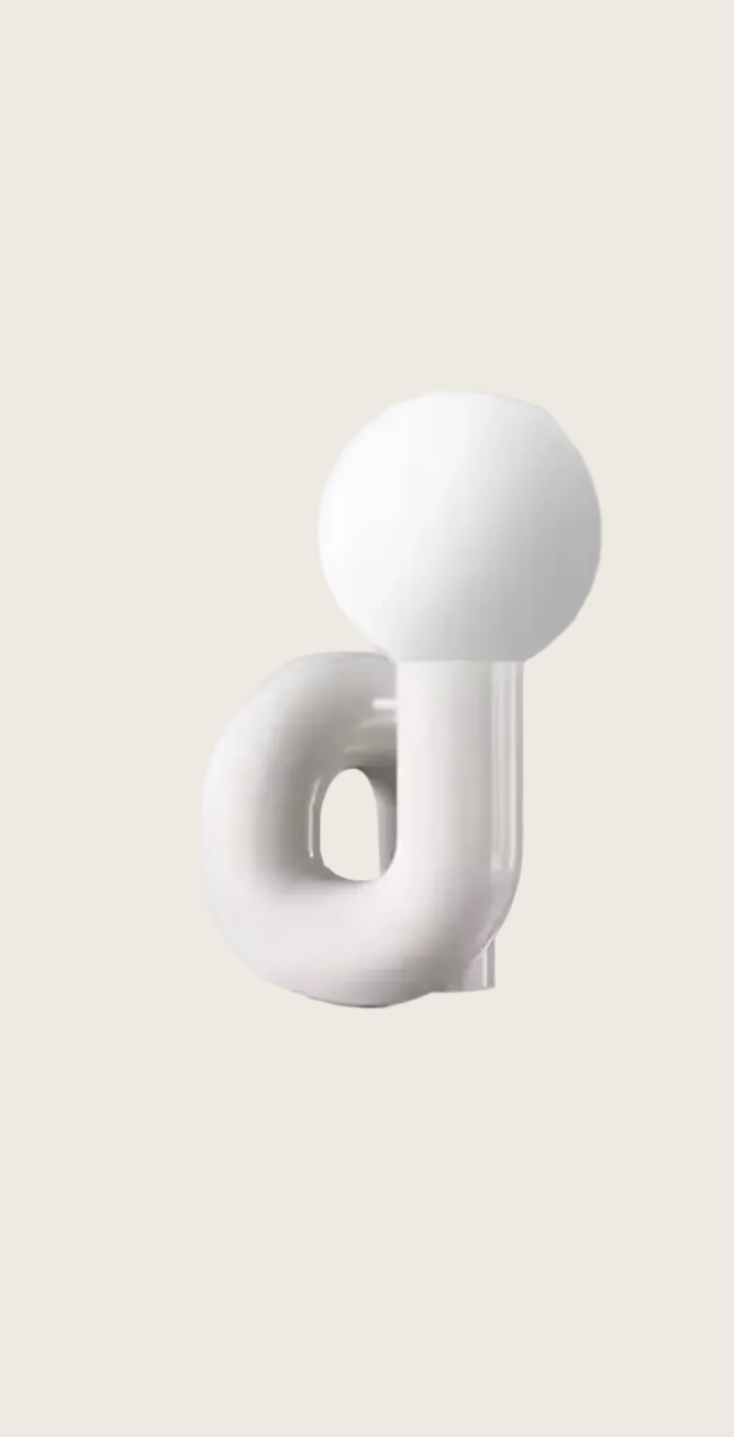 White abstract sculpture on a light gray background