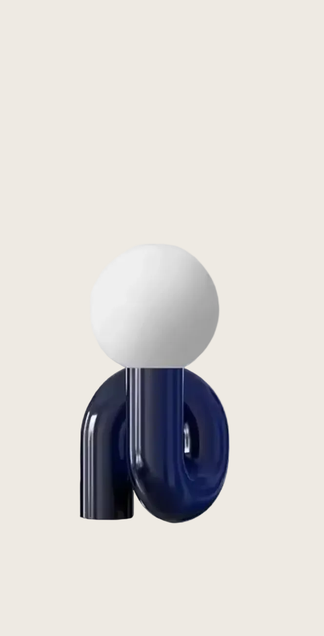 White spherical object on a blue cylindrical stand against a light gray background